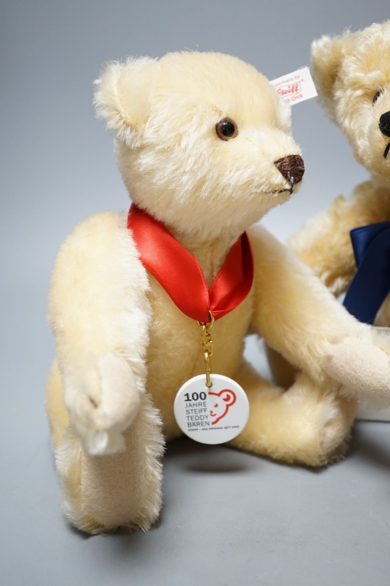 A Side-To-Side Steiff bear, white label, 35cm, box / certificate, together with an Anniversary Bear Box 25cm. a Steiff Bunny Campione bear with box and certificate, 28cm